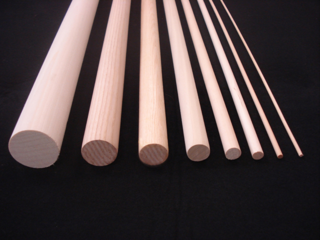 Eight wooden dowels in various sizes from largest diameter to thinnest diameter